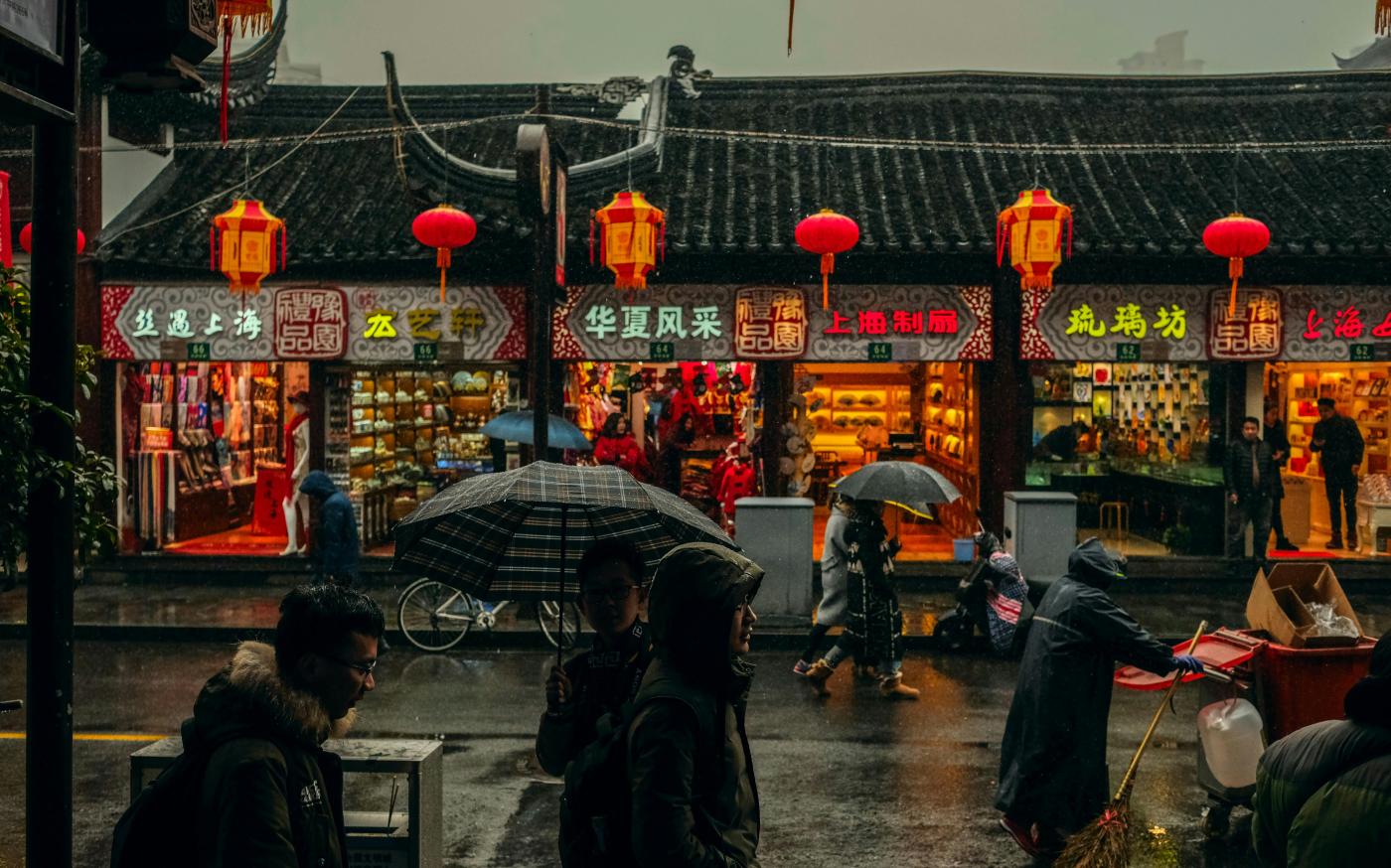 person carrying umbrellas by Nuno Alberto courtesy of Unsplash.