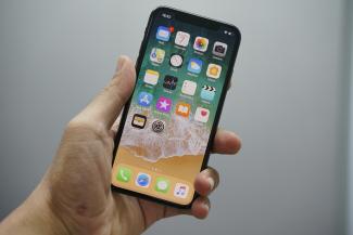 person holding space gray iPhone 7 by Bagus Hernawan courtesy of Unsplash.